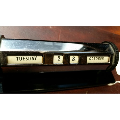 229 - 1930/40’s Chrome desk calendar on a heavy bakelite base. 5.75 inches wide x 2 inches high. Con... 