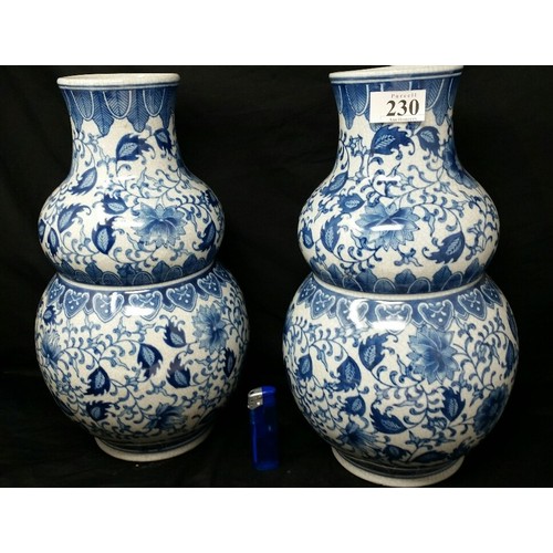 230 - A good pair of Chinese double gourde vases with underglaze blue floral pattern. Mid to late 20th Cen... 