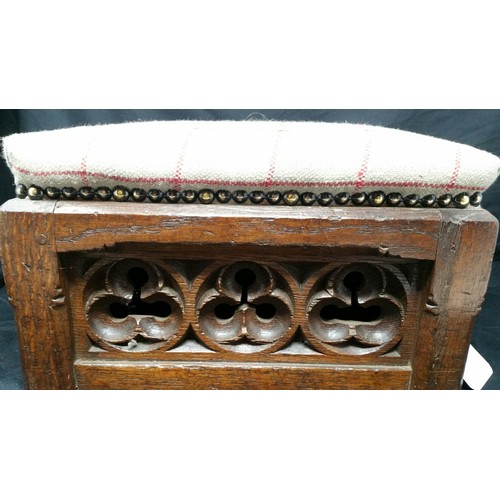 248 - A heavy quality 19th Century upholstered oak footstool in the gothic manner. Recently recovered Size... 