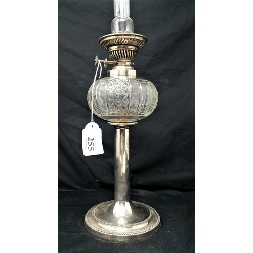 255 - A very nice 19th century silverplated oil lamp of slender proportions with cutglass bowl. The silver... 