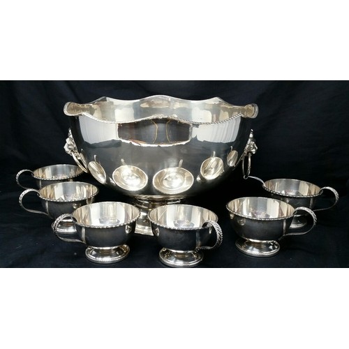 267 - Early to mid 20th Century silver plated punch bowl with 6 silverplated cups. Punch bowl stands 7 inc... 