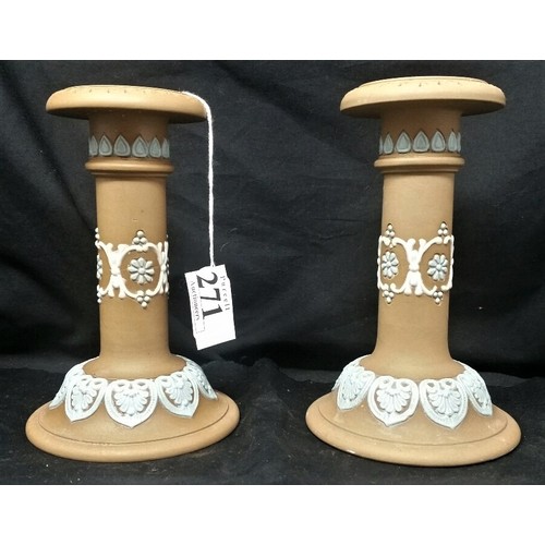 271 - A pair of early 20th Century Doulton candlesticks with applied Wedgwood blue and cream decoration. 6... 