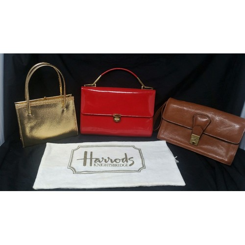 276 - Three Vintage handbags/clutch bags. Gold bag unbranded. Red patent bag bearing the name of Harrods w... 