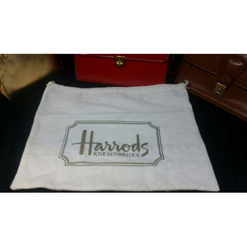 276 - Three Vintage handbags/clutch bags. Gold bag unbranded. Red patent bag bearing the name of Harrods w... 