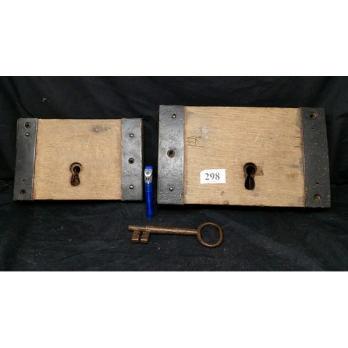 298 - Two large 19th Century door locks and a similar period metal key. Larger lock 10 x 6 inches and the ... 