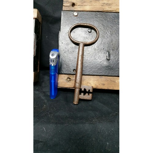 298 - Two large 19th Century door locks and a similar period metal key. Larger lock 10 x 6 inches and the ... 