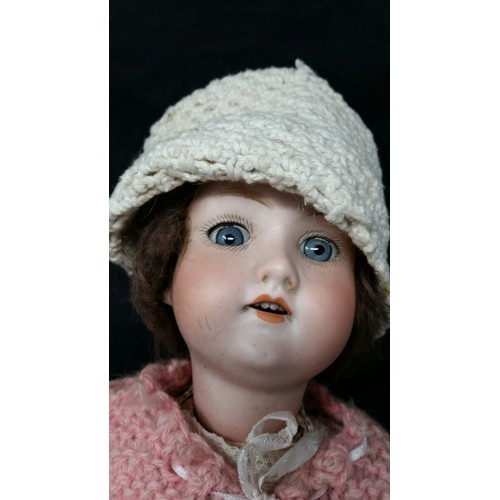 285 - A German early 20th Century doll by Armand Marseilla. This doll is of timber construction with a cer... 