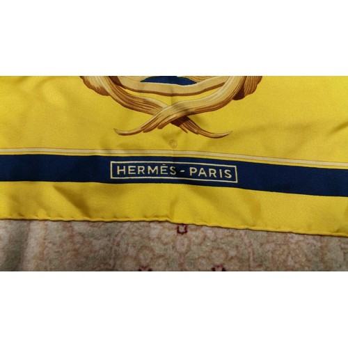 287 - A vintage silk scarf bearing the mark of Hermes Paris. Size 90cm x 90cm. Hand rolled edges and stitc... 