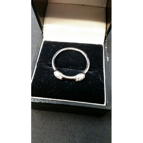 293 - 18ct white gold and diamond double pod love ring. Each pod with 7 small diamonds. Size N.