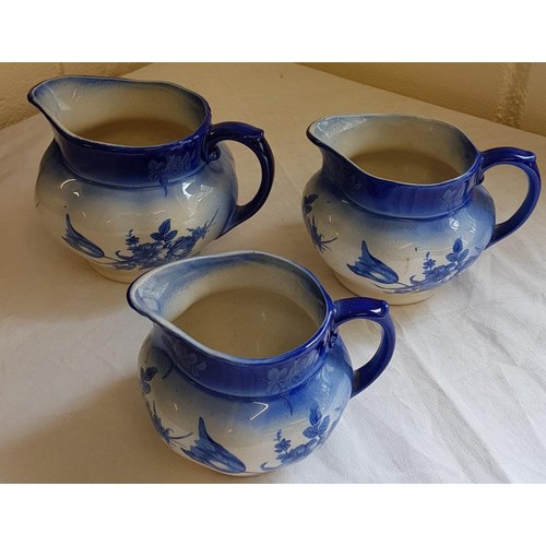 33 - Three Floral Decorated Blue and White Jugs