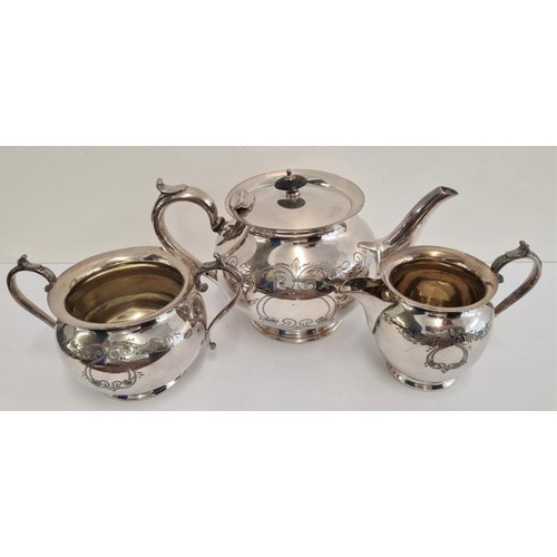 65 - Three Piece Silver Plated Tea Set, the sugar bowl and cream with gilded interior.