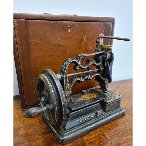 68 - W B Moore, 51 Grafton St., Dublin Cast Iron Sewing Machine (c.10in x 8in) within a mahogany travel c... 