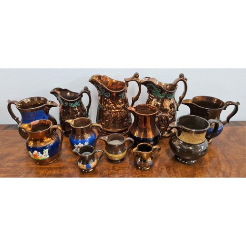 74 - Collection of 12 Victorian Lustre Ware Jugs some as found