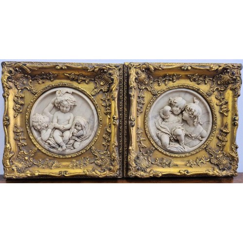 82 - Exceptional Pair of 19th Century Carved Relief Plaques of Putti with highly decorative gilt frames, ... 