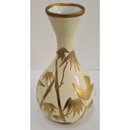 147 - Japanese Bud Vase profusely decorated with gold birds among trees and all on a pale yellow ground. c... 