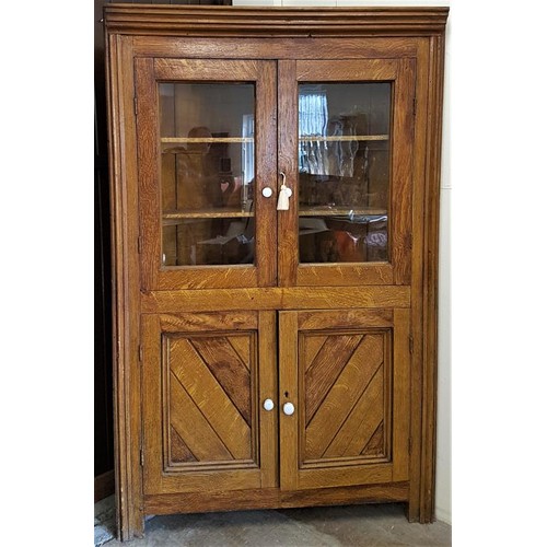 111 - Rare Irish Scrumble Pine Corner Display Cabinet, with a moulded crown over a pair of glazed doors on... 