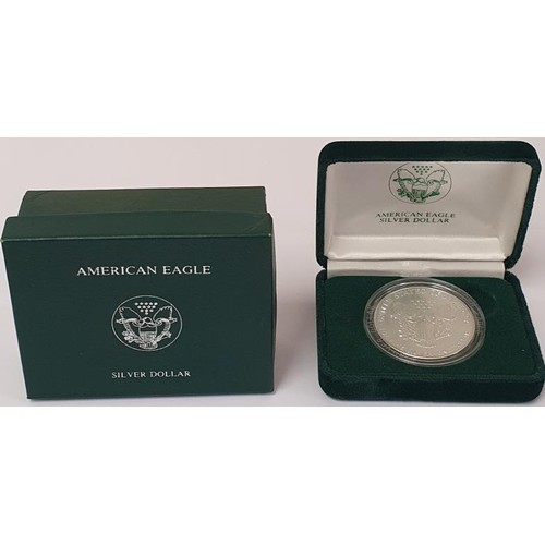 192 - 1989 American Eagle Silver Dollar, in original box and with certificate of authenticity. 1 troy ounc... 