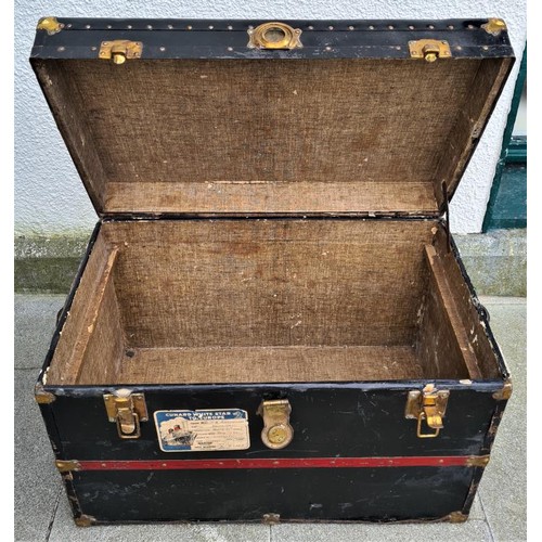 434 - Cunard White Star Line. A Flat Top, Brass Bound Steamer Cabin Trunk which travelled on the MV Britan... 