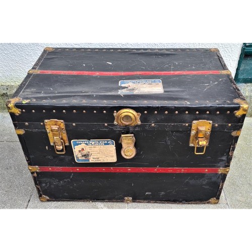 434 - Cunard White Star Line. A Flat Top, Brass Bound Steamer Cabin Trunk which travelled on the MV Britan... 