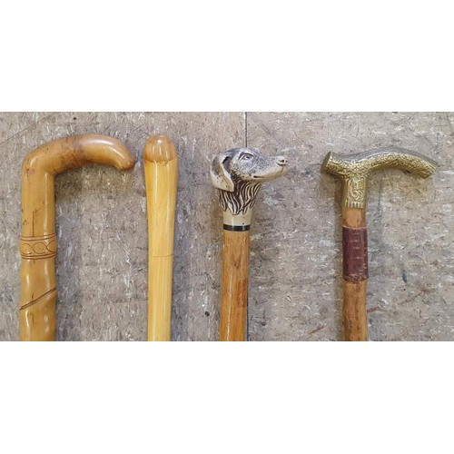 437 - Collection of Four Walking Sticks, one with dog head detail