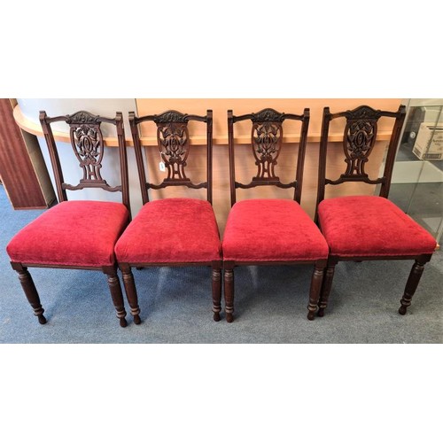 446 - Set of Four Edwardian Mahogany Dining Chairs with carved and pierced seat back and over-stuffed seat... 