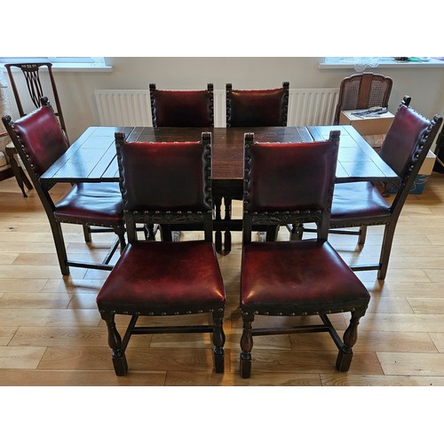 266 - Vintage Oak Dining Room Suite, comprising extending dining table and a set of 6 carved and leather u... 