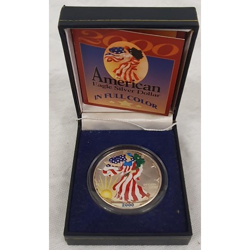 106 - 2000 USA Eagle Silver Dollar in Full Colour in original presentation case and certificate of authent... 