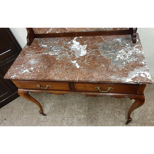 392 - Edwardian Mahogany And Marble Washstand, the carved op with bevelled mirror pane above a purple vein... 