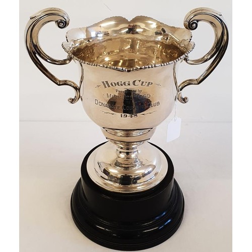 Substantial Irish Silver Trophy Cup "Hogg Cup Presented by Miss J Hogg to Donabate Coursing Club 1948" on a stepped and ebonised pedestal. Hallmarked Dublin c. 1908. c.870grams, Cup c.29cm tall plus pedestal