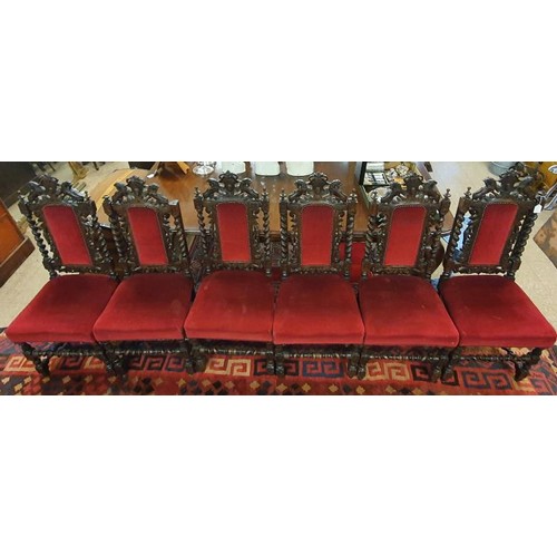 466 - Set of Six Victorian Gothic Oak Revival Dining Chairs. The tops with rampant lions over an upholster... 