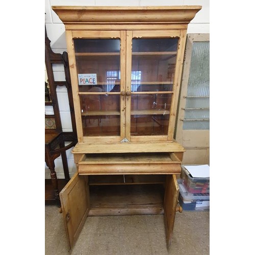 485 - 19th Century Pine Kitchen Dresser/Cabinet. The moulded top above a pair of glazed doors on a base wi... 