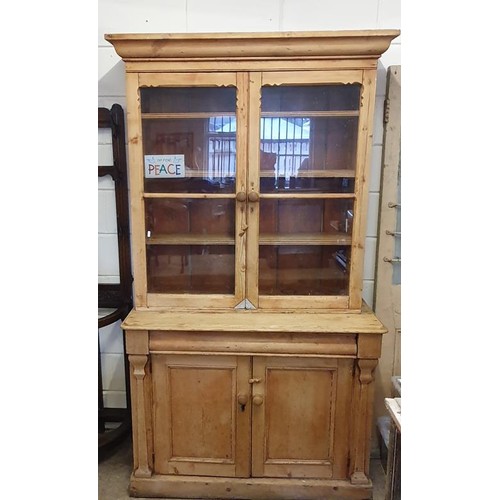 485 - 19th Century Pine Kitchen Dresser/Cabinet. The moulded top above a pair of glazed doors on a base wi... 