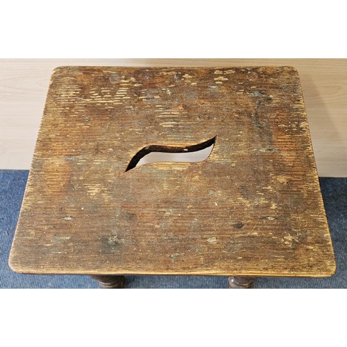 424 - Victorian Pitch Pine and Oak Frame Stool, the rectangular top with carry slot above four turned legs... 