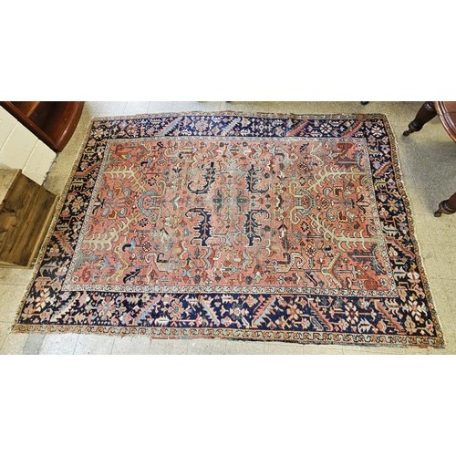 439 - Eastern Floor Rug, a large central panel with geometric shapes on a pink ground surrounded by furthe... 