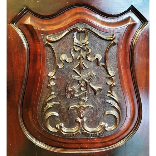 437 - Edwardian Mahogany Music Cabinet, the shaped top above a single door carved with musical instruments... 