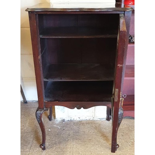 437 - Edwardian Mahogany Music Cabinet, the shaped top above a single door carved with musical instruments... 