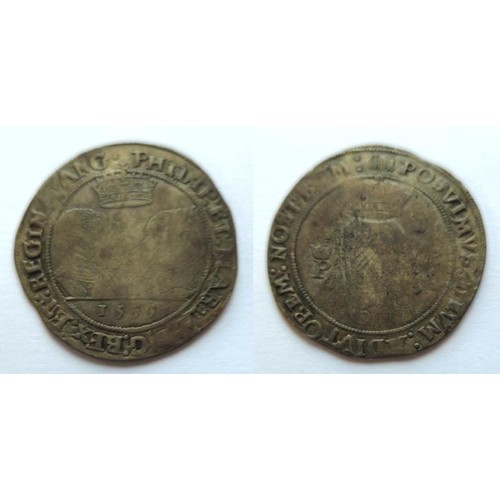 Ireland Philip & Mary 1554-1558. Shilling 1555. Obv busts face to face under a crown date below. Legend reads Rigina. Reverse crowned harpa between P and M. M.M. Portcollis. D.F.233 S6500. This is an exceptional coin of this base issue. Legends bold and strong on reverse and obverse. Lightly struck in centre on both sides. Good very fine.