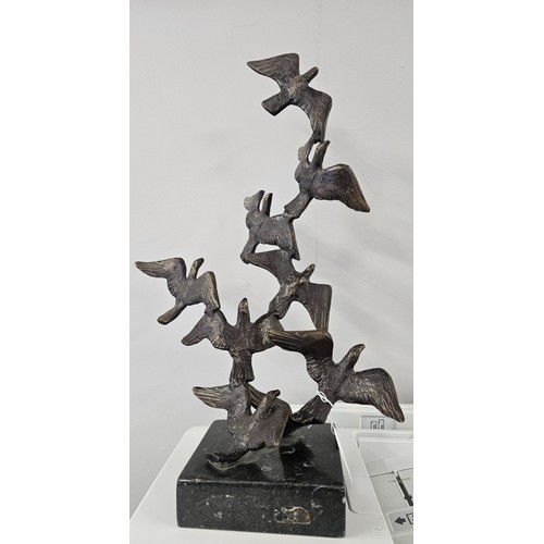 John Behan, RHA, b.1938, Flight Of Birds. On a black Kilkenny marble base. Total weight c.3.5KG. Measures c.42cm tall, c.30cm wide. Indistinctly initialled underneath a lower wing.