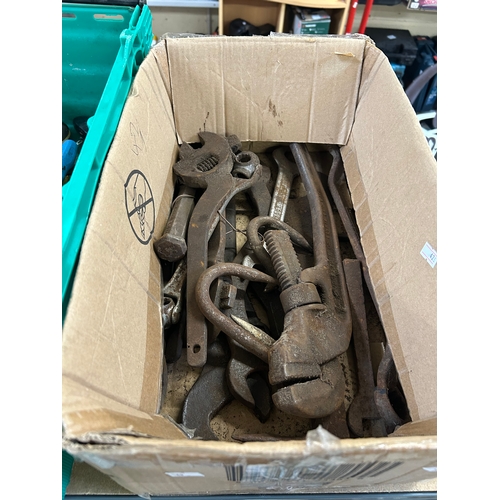 Collection of vintage iron hand tools including pipe wrenches and ...
