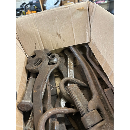 Collection of vintage iron hand tools including pipe wrenches and ...
