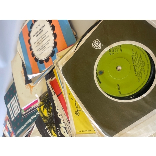 A stack of vinyl records, including 7-inch singles