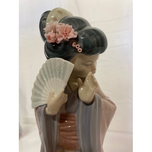 62 - Four Lladro figurines Jolie 5210 with Parasol, Pretty Picking 5222. Girl with Lilies, and a shy Geis... 