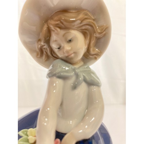 62 - Four Lladro figurines Jolie 5210 with Parasol, Pretty Picking 5222. Girl with Lilies, and a shy Geis... 