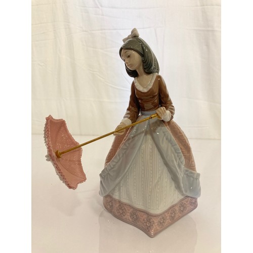 62 - Four Lladro figurines Jolie 5210 with Parasol, Pretty Picking 5222. Girl with Lilies, and a shy Geis... 