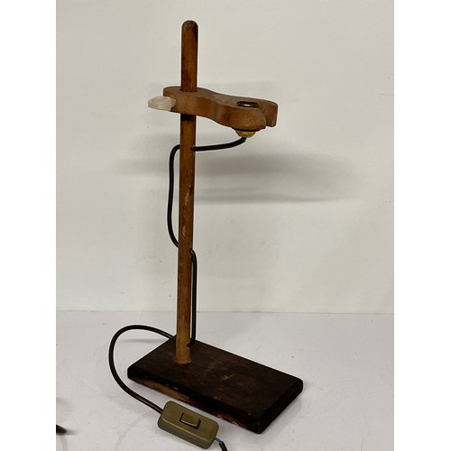 22 - Table lamp, an industrial wooden laboratory stand converted to a desk light, 55cm high

This lot is ... 