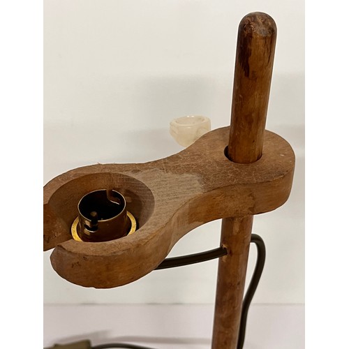 22 - Table lamp, an industrial wooden laboratory stand converted to a desk light, 55cm high

This lot is ... 