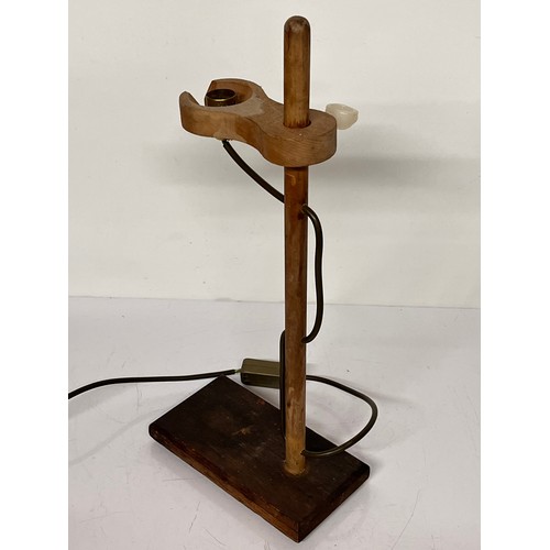 22 - Table lamp, an industrial wooden laboratory stand converted to a desk light, 55cm high

This lot is ... 