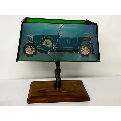 38 - Motoring themed table lamp, stained glass shade features a Le mans Bentley racing car, the lamp stem... 