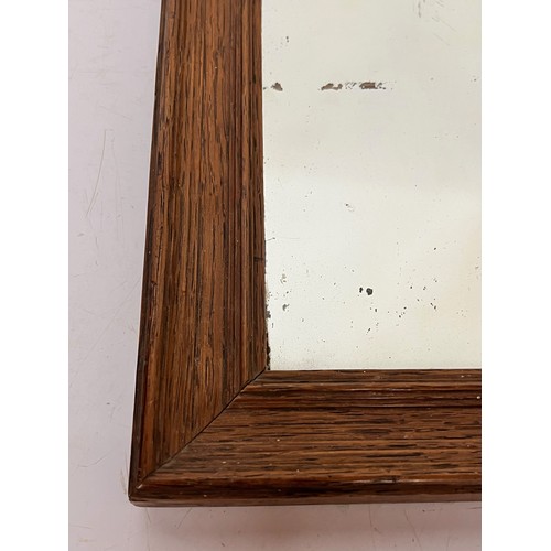 167 - Small Edwardian period Oak framed wall mirror with original period newspaper decoration to back boar... 