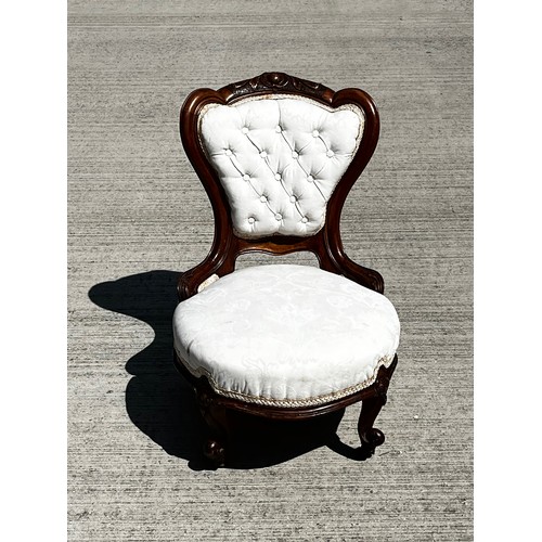 45 - Victorian upholstered nursing chair, with a carved mahogany frame.

This lot is collection only